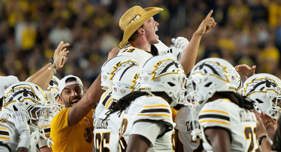 Western Michigan celebrates after the first hail mary from Michigan's offense, which dropped incomplete before a second was added back to the clock