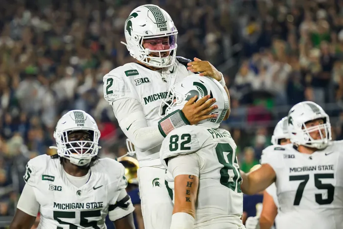 Cam Fancher celebrates after scoring for the Spartans